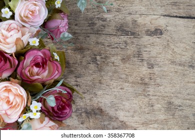 Vintage rose flowers on rustic wooden background. Copy space.
 - Powered by Shutterstock