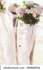 Vintage roses bouquet arrange for wedding decoration with sea background - Shutterstock ID 589860926