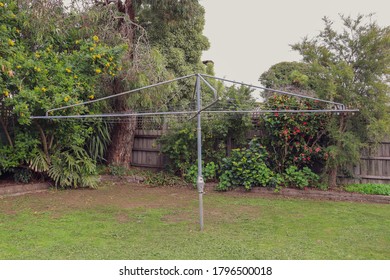 Vintage Rotary Clothes Line In Backyard