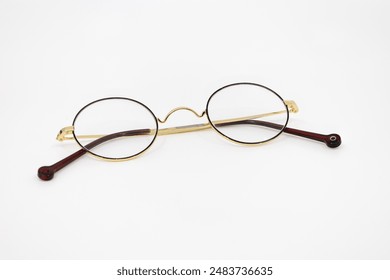 Vintage Round Glasses with Gold Frame on White Background - Powered by Shutterstock