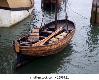 Vintage Row Boat, Along The Side Of The Mayflower Ship In Plymouth, Mass.