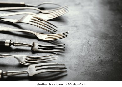 Vintage Rustic Cutlery On Dark Old Background. 