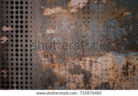 The vintage rusty grunge steel decorated by drilling a wall textured background. Wall steel rust resistant nature.