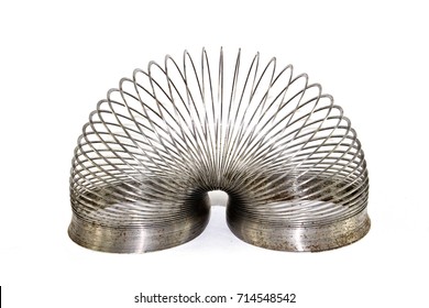 Vintage Rusty Metal Slinky toy on White Background