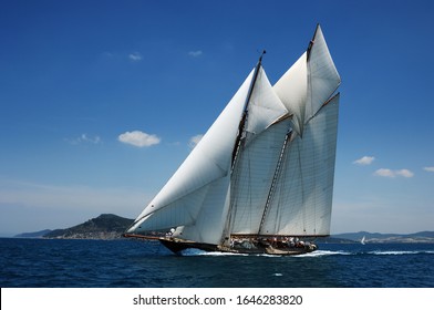 Vintage Sailboat With Many Sail Sailing Upwind