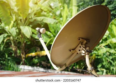 Vintage satellite receiver dish on the roof in rural house. Concept : Terrestrial TV receivers. TV antenna. Device technology for receiving television broadcasting                           - Shutterstock ID 2203160747