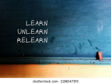 Vintage school chalkboard with handwritten text Learn Unlearn Relearn - concept of knowing to discard learned outdated knowledge or skills or fake information and ready to relearn new ones