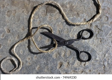 Vintage Scissors Cutting A String