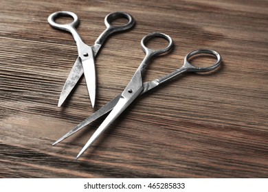 Vintage Scissors On Wooden Background