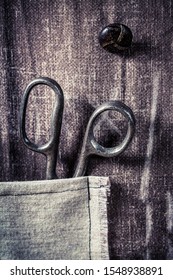 Vintage scissors in pocket on the mat tailor