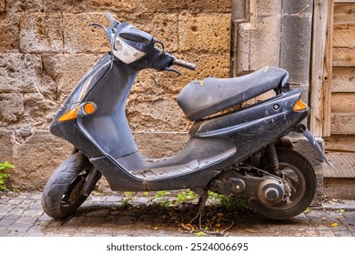 Vintage scooter parked outside old building wall. Italy - Powered by Shutterstock