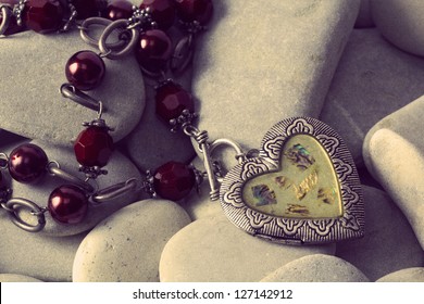 Vintage  silver locket lost in the stones - Powered by Shutterstock