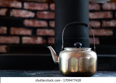 Vintage Silver Tea Kettle On Top Of Wood Stove 