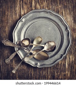 Vintage Silverware On Rustic Metal Plate