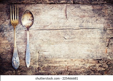 Vintage silverware on rustic wooden background  - Powered by Shutterstock