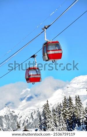 Vintage Ski gondola over the slopes of Courchevel ski resort, French alps