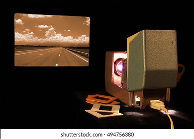 Vintage Slide Projector In Dark Room