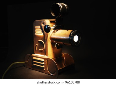 Vintage Slide Projector With The Light In Dark Room