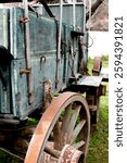 Vintage stagecoach and wagon wheel in outdoor park