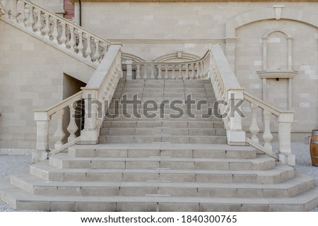 Vintage stairs from white marble in an old antique building