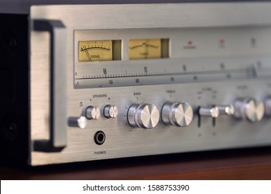 Vintage Stereo Receiver Front Panel with Controls Side View Closeup - Powered by Shutterstock