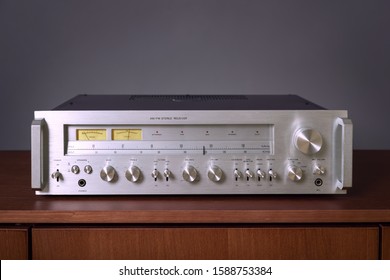 Vintage Stereo Receiver Standing on the Wooden Sideboard, Frontal View - Powered by Shutterstock