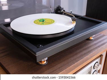 Vintage Stereo Turntable Plays white Vinyl Record Album, Tonearm with Headshell Closeup 
