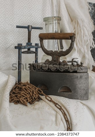 Vintage Still Life with Iron, Glass, Metal, Wood, and Leather