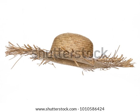Vintage straw beach hat hat, isolated on white background.  Side view. Tilted up a little, showing the interior.