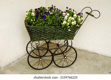 Vintage Stroller Reused As Plant Pots Holder.