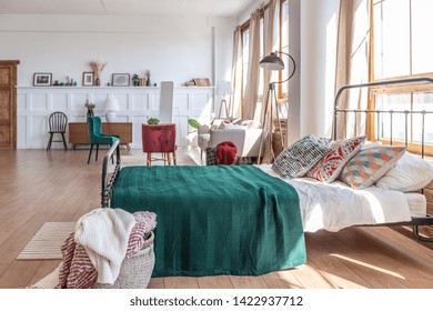 Vintage Studio Apartment Interior In Light Colors In Old Style. Huge Room With Large Windows With A Living Room Area And A Bedroom Area. Direct Sunlight Inside.