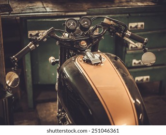 Vintage Style Cafe-racer Motorcycle In Customs Garage 