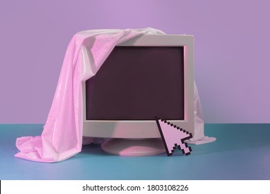 Vintage style concept with old Monitor screen and glitter fabric. Technology background. Retro fashion aesthetic.