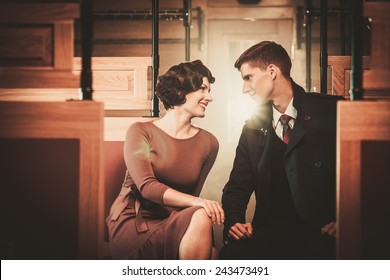 Vintage Style Couple Inside Retro Train Coach 