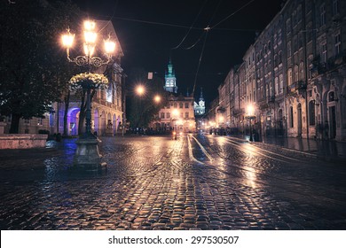 Vintage Style Image Of Old European City At Night