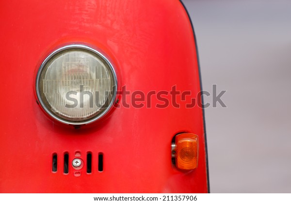 Vintage style\
motorcycle light with red\
body