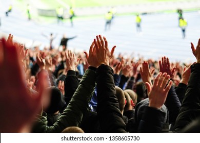 Vintage Style Photo Of A Crowd, Happy People Enjoying Rock Concert, Raised Up Hands And Clapping Of Pleasure, Active Night Life Concept