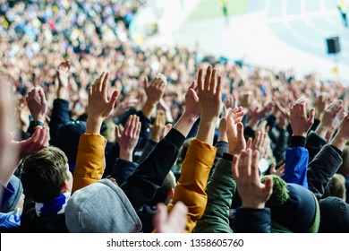 Vintage Style Photo Of A Crowd, Happy People Enjoying Rock Concert, Raised Up Hands And Clapping Of Pleasure, Active Night Life Concept