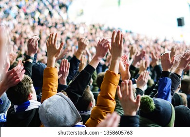 Vintage Style Photo Of A Crowd, Happy People Enjoying Rock Concert, Raised Up Hands And Clapping Of Pleasure, Active Night Life Concept