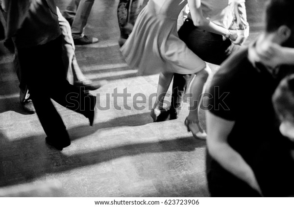 Vintage\
style photo of dance hall with people\
dancing