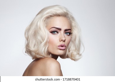 Vintage Style Portrait Of Young Beautiful Blonde Girl With Fancy Makeup