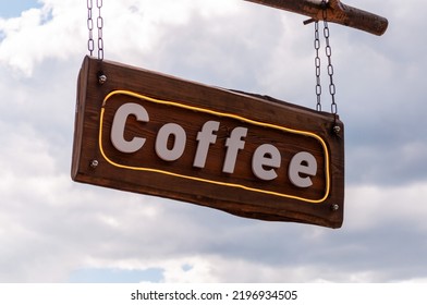 Vintage style sign for black filtered coffee on a blackboard with a wooden frame. Landscape format.