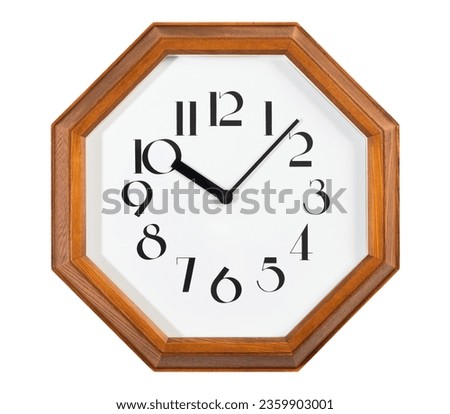 Vintage style of wooden wall clock with octagonal shape isolated over white background.
