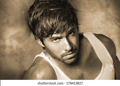 Vintage Stylized Monochrome Sepia Classic Portrait Of Young Male Model (Photo Has An Intentional Film Grain)