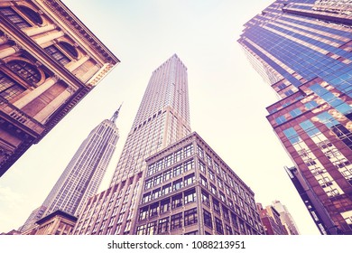 Vintage stylized photo of Manhattan skyscrapers, looking up perspective, New York City, USA.  - Shutterstock ID 1088213951