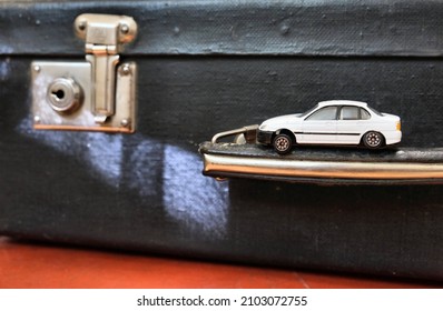 Vintage Suitcase And Car Toy, Nostalgic, Travel  And  Adventure Concept