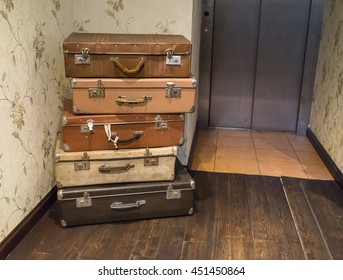 vintage suitcases near the elevator