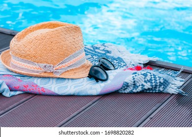 Vintage Summer Wicker Straw Beach Hat, Sun Glasses And Cover-up Beachwear Wrap Near Swimming Pool, Tropical Background