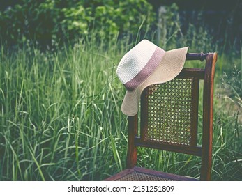 Vintage Sun Hut On An Old Chair In Grass. Copy Space