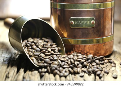 vintage Swedish coffee can with manufacture roasted Indonesian Arabica coffee beans on rustic wooden background (translation: coffee)